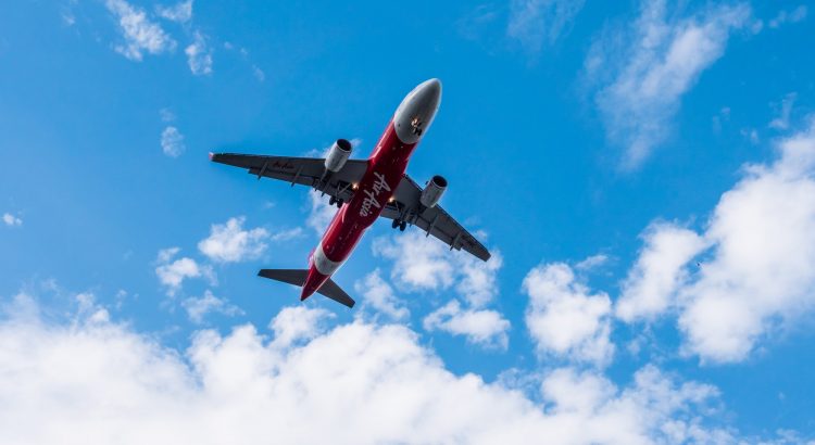 Airplane flying on blue sky